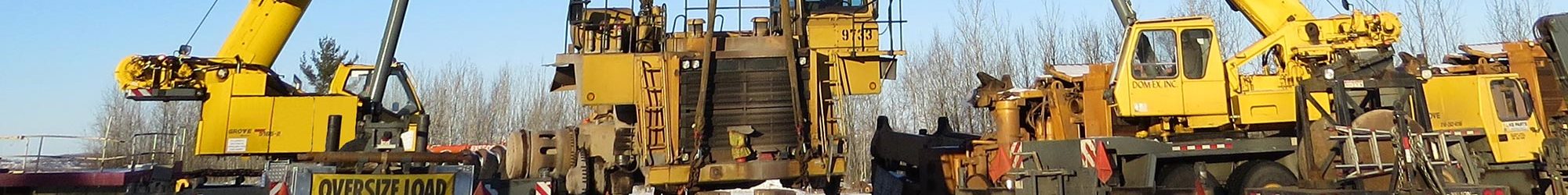 Haul truck rebuild process including crane lift