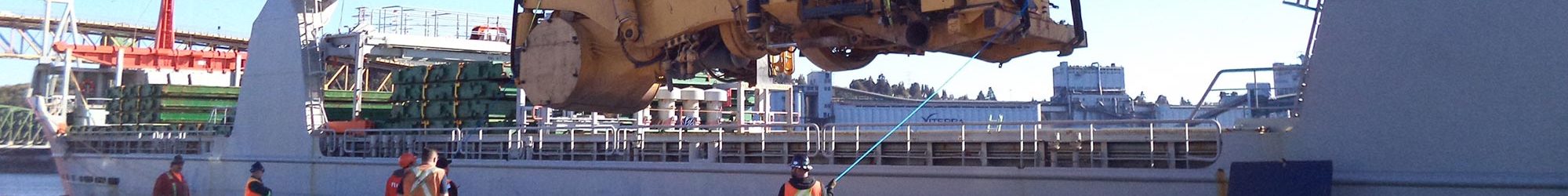 Haul truck subframe being unloaded from a transport ship