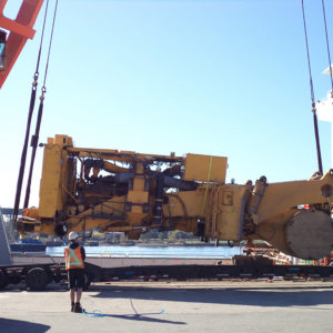 Global relocation project of Komatsu 830E, truck body being loaded onto cargo ship