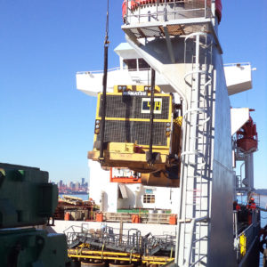 Global relocation project of Komatsu 830E, truck body being loaded to cargo ship