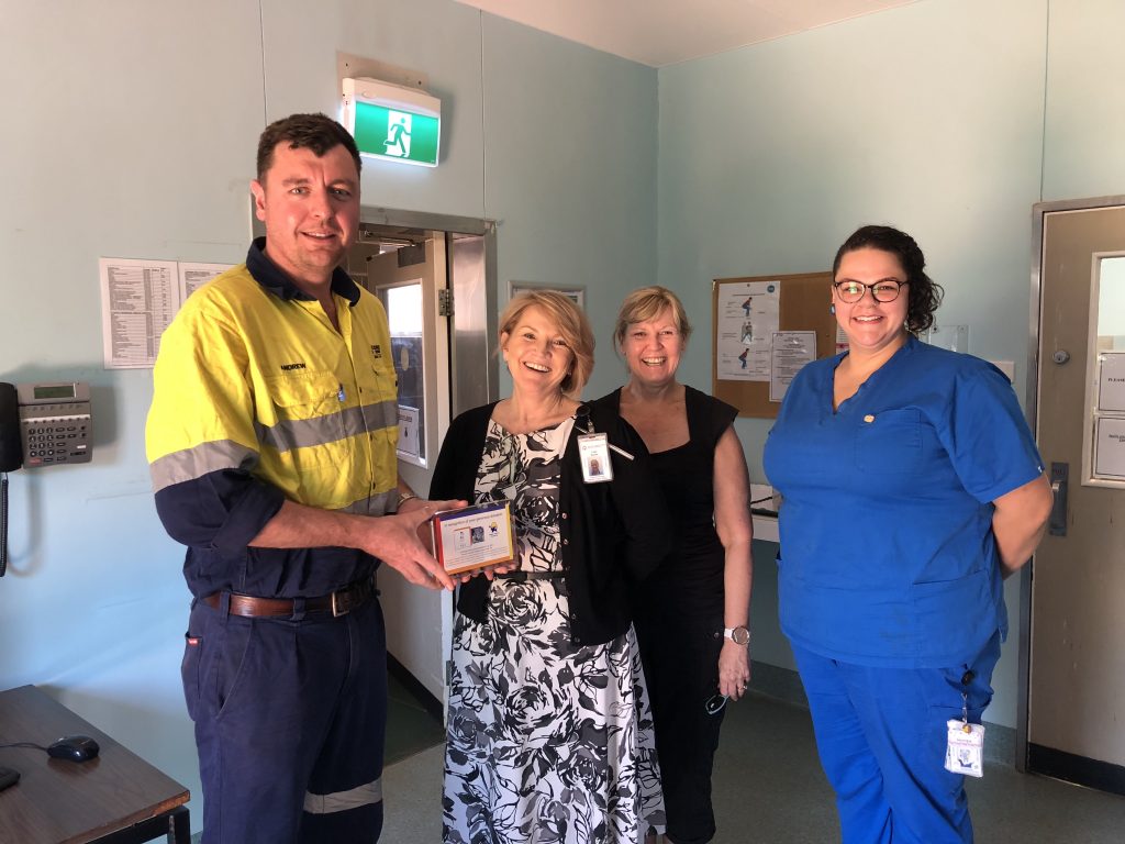 Presentation of donation to the Newman Hospital by H-E Parts Representative