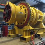 Komatsu 930E rear wheel group loaded on transport frame and ready for transport
