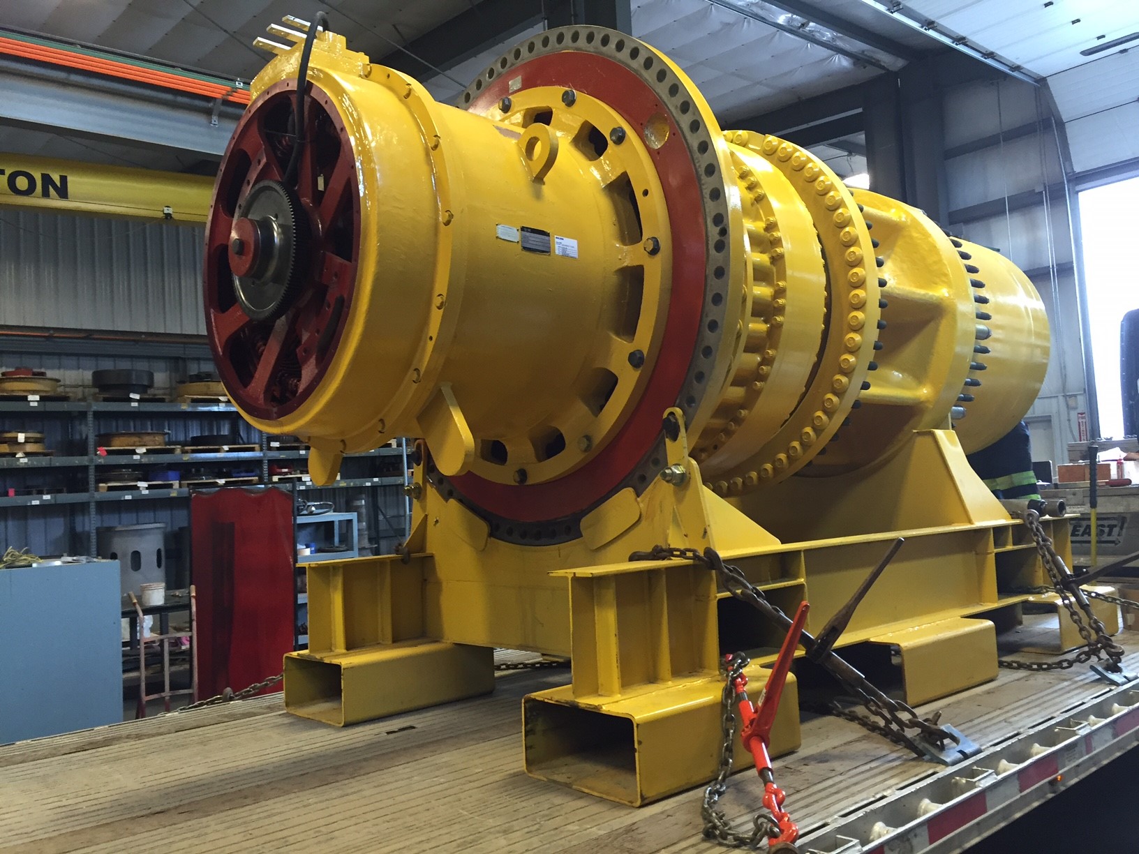 Komatsu 930E rear wheel group loaded on transport frame and ready for transport